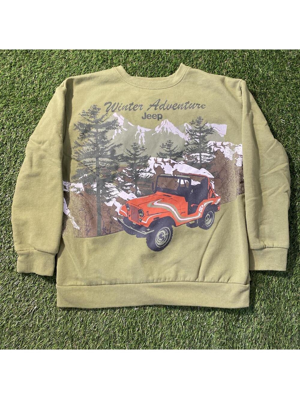 Jeep winter adventure sweatshirt with red Jeep in a snowy forest scene